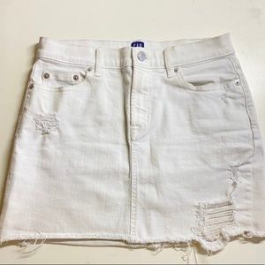White denim mini skirt with rips